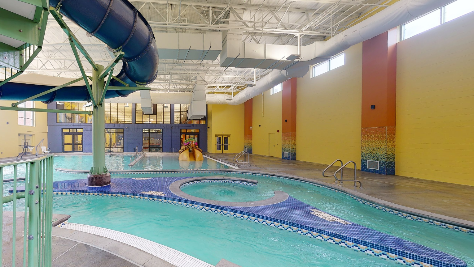 905021185986697_omaha_jcc_indoor_leisure_pool_view_from_slide_steps_vortex_lazy_river_zero_entry_play_features